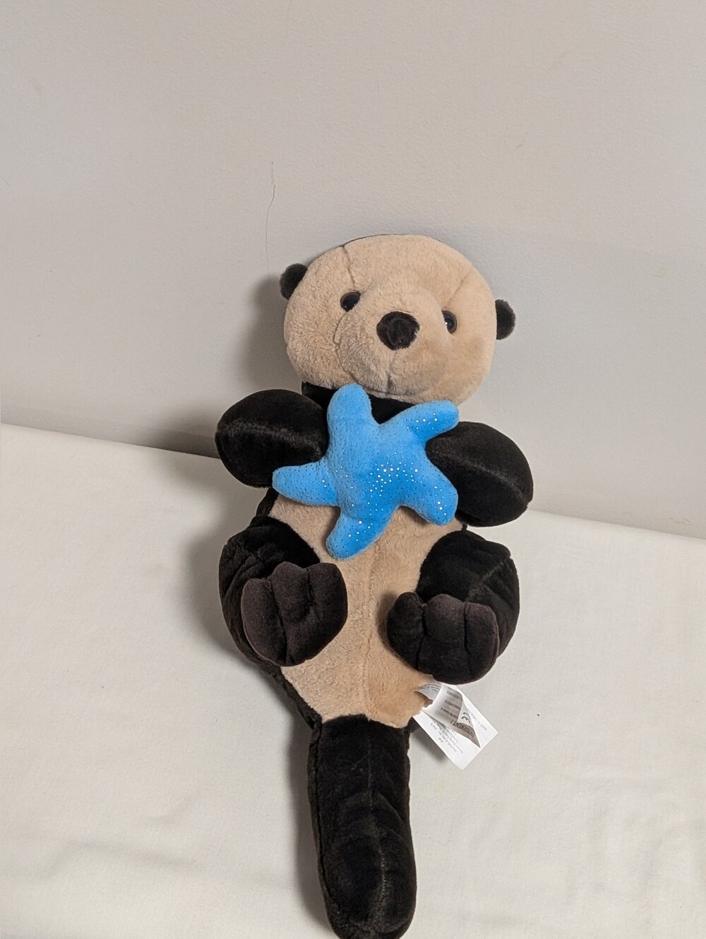Marshals. Plush Sea Otter Holding Blue Starfish. Velvety Touch. Pocket In Back.